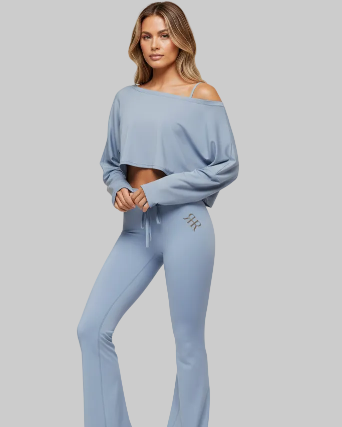 Woman wearing a light blue loungewear set with 'FFK' branding on a beige background