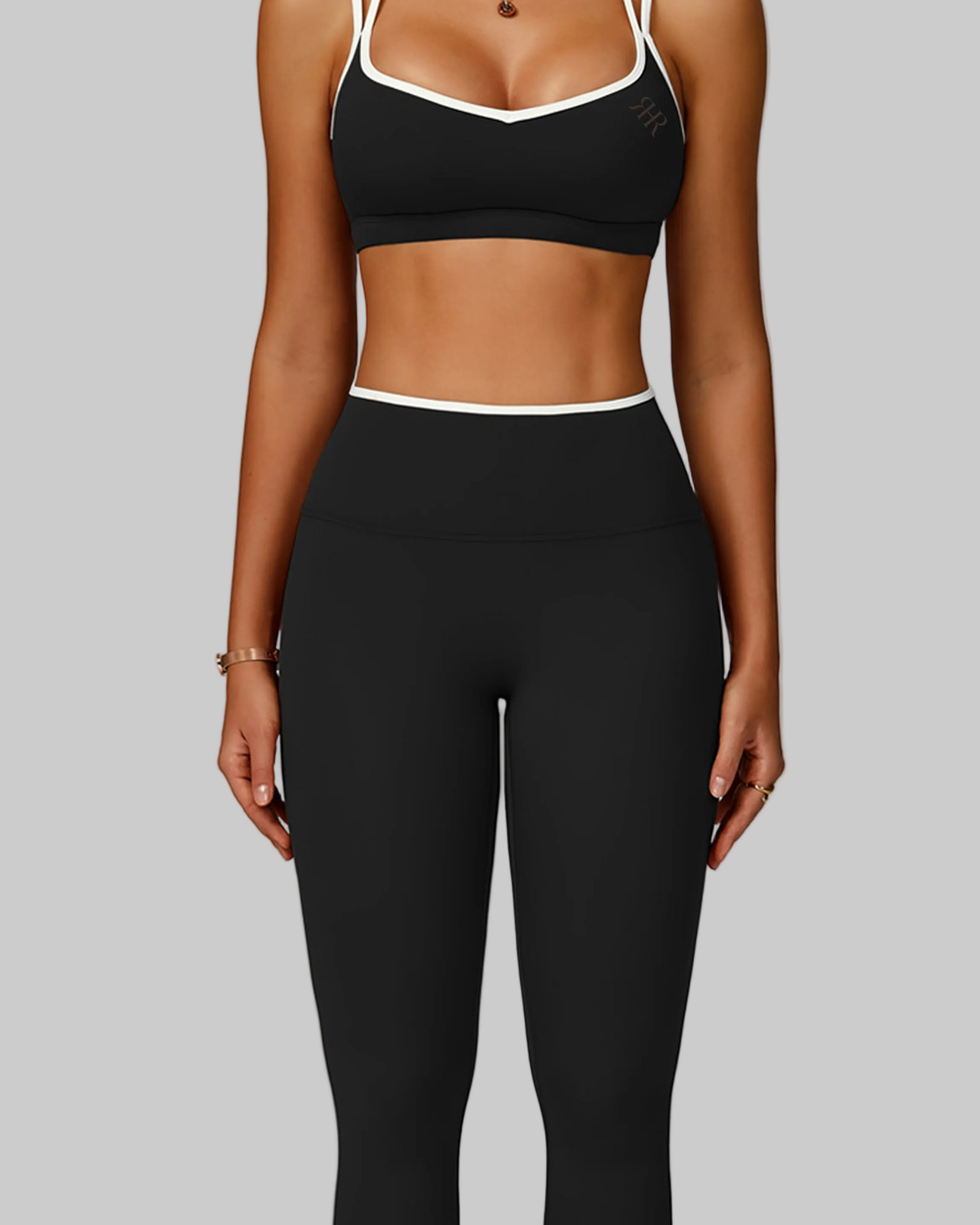 Woman wearing a black sports bra and leggings set, sport workout activewear set canada
