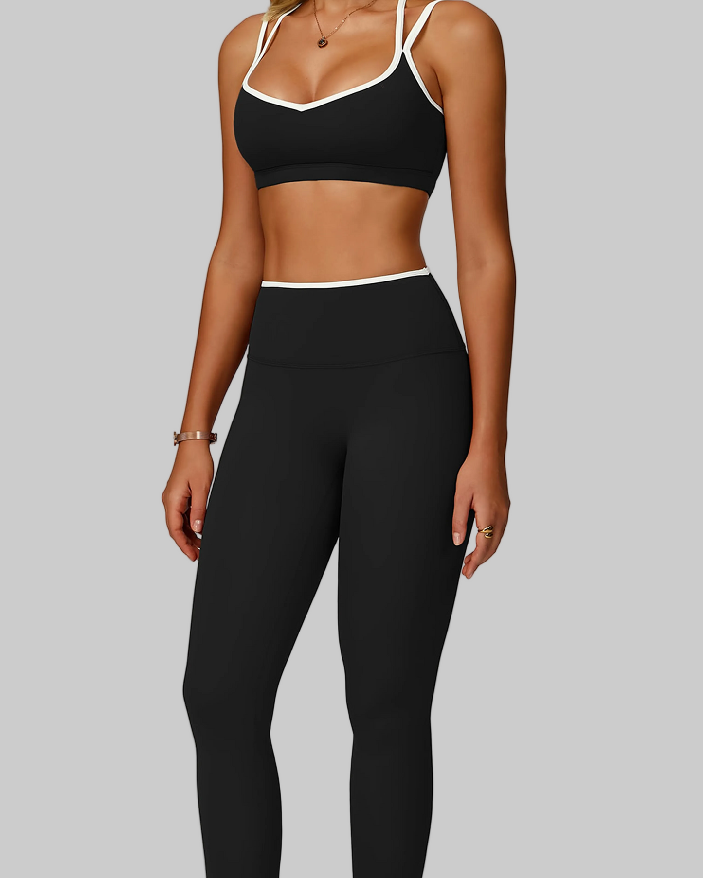 Woman wearing a black sports bra and leggings set, sport workout activewear set canada