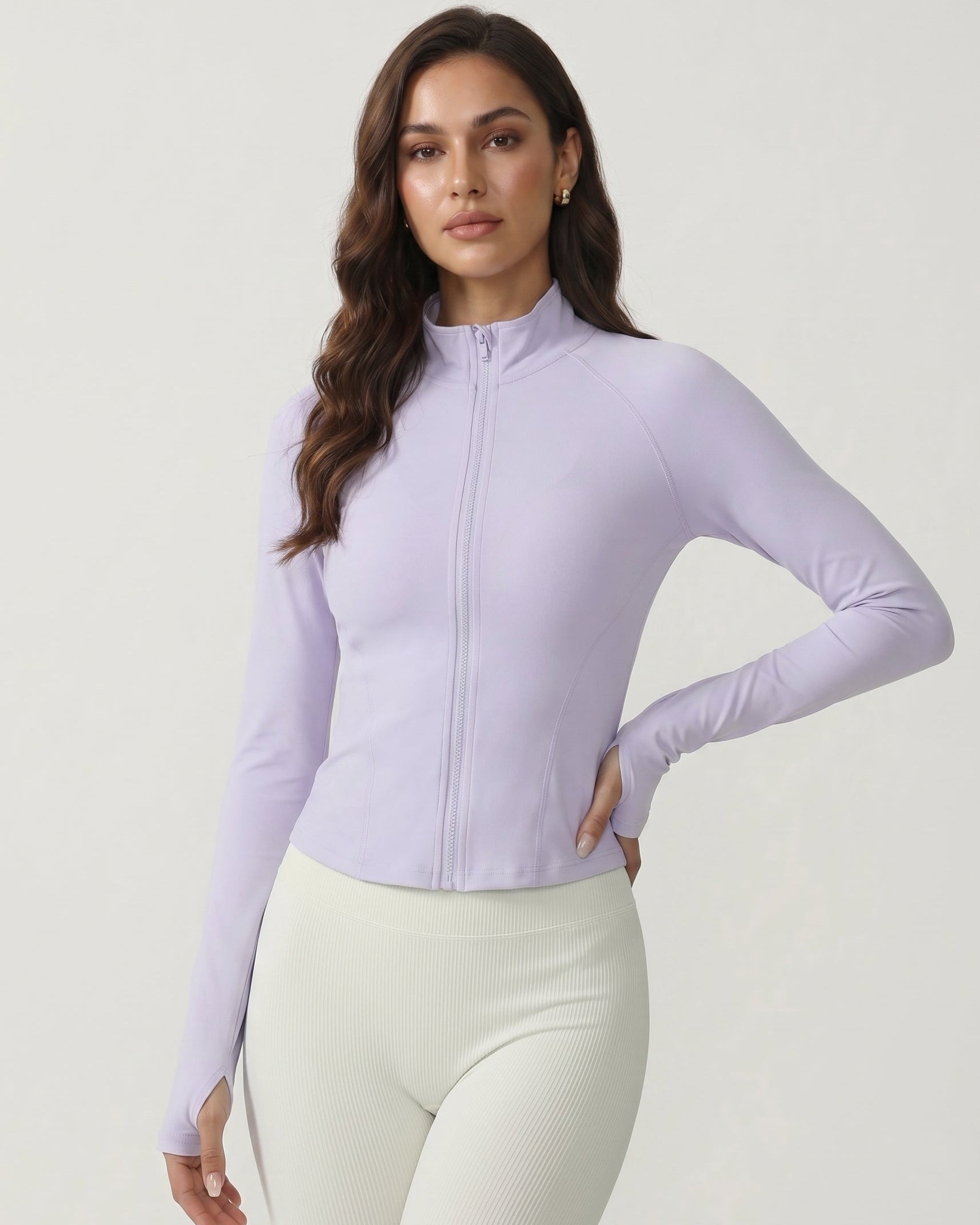 Woman wearing a light purple long-sleeve top with a zipper on a white background